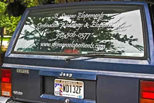 Vinyl lettering on a vehicle window