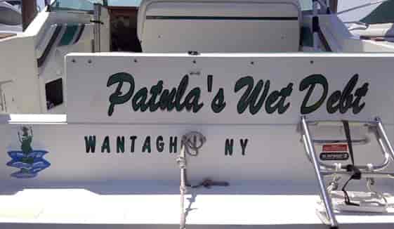 Custom lettering and graphics on a boat
