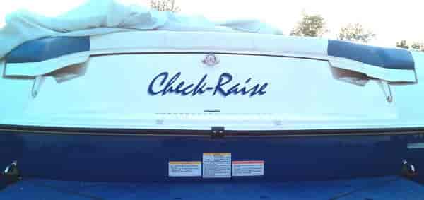 Custom vinyl lettering on a boat.