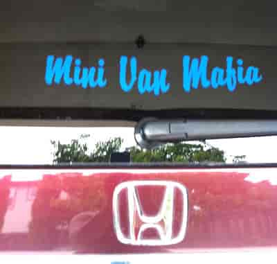 Vinyl lettering on a mini van.
