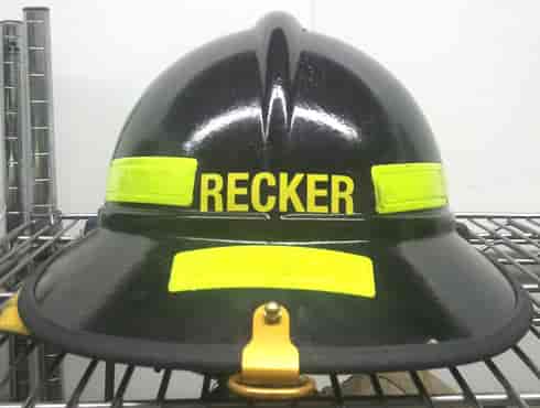 Custom lettering on a fireman's helmet.
