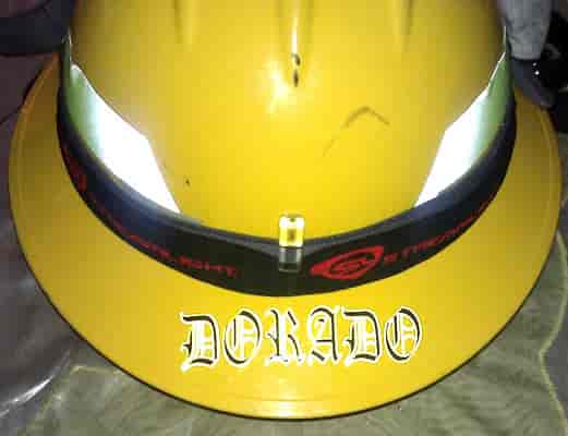 Custom lettering on a firemans helmet.