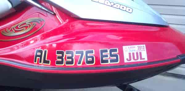 Custom vinyl registration numbers on a jet-ski