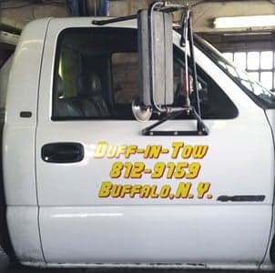 Custom lettering on a tow truck Custom lettering on a tow truck