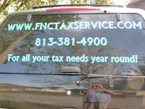 Vinyl lettering on a vehicle window