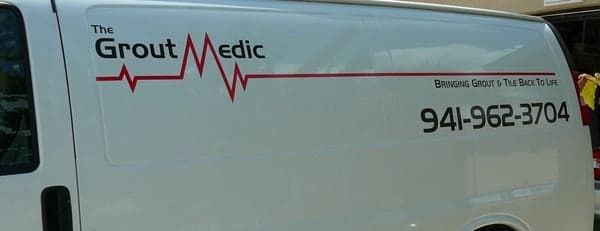 Vinyl Lettering and Logo on a work van Vinyl Lettering and Logo on a work van