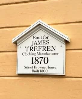 Black lettering on a house sign 