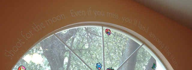 Vinyl Lettering Arched Above a Window Vinyl Lettering Arched Above a Window