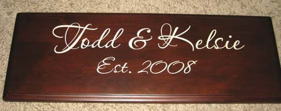 Custom lettering on a wooden sign