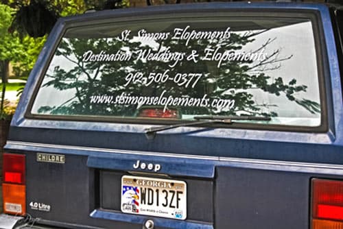 Vinyl lettering on a vehicle window Vinyl lettering on a vehicle window