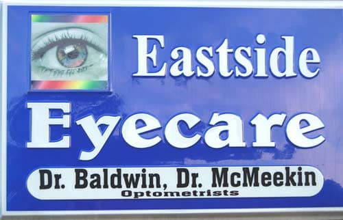 Custom vinyl lettering on an outdoor sign