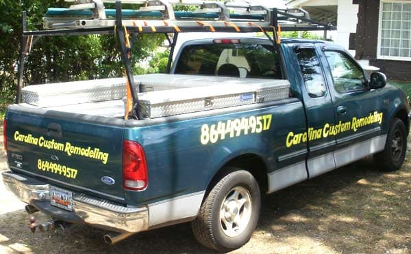 Vinyl lettering on a work truck Vinyl lettering on a work truck