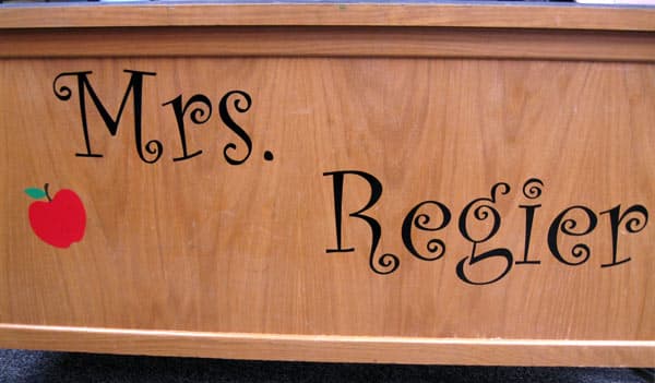 Vinyl lettering and graphic on a desk