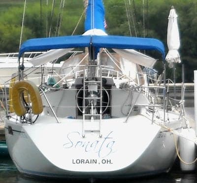 Vinyl boat name and registration number.