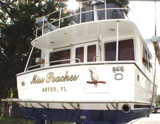 Custom lettering and graphic on a boat. Custom lettering and graphic on a boat.