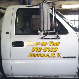Custom lettering on a tow truck Custom lettering on a tow truck