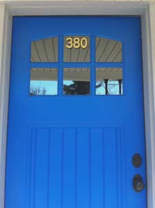 Vinyl lettering on a glass window above a door Vinyl lettering on a glass window above a door