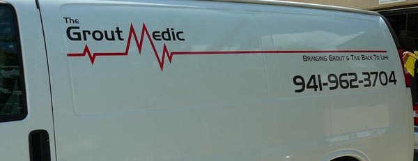 Vinyl Lettering and Logo on a work van Vinyl Lettering and Logo on a work van