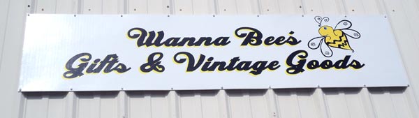 Custom lettering on a store front sign Custom lettering on a store front sign