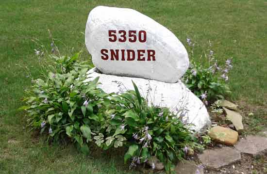 Lettering on a painted rock Lettering on a painted rock