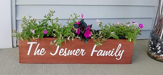 Vinyl lettering on a flower planter Vinyl lettering on a flower planter