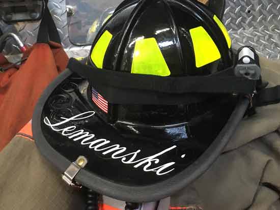 Lettering on a fire helmet Lettering on a fire helmet