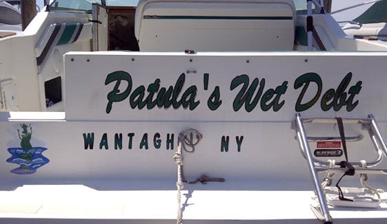 Custom lettering and graphics on a boat Custom lettering and graphics on a boat
