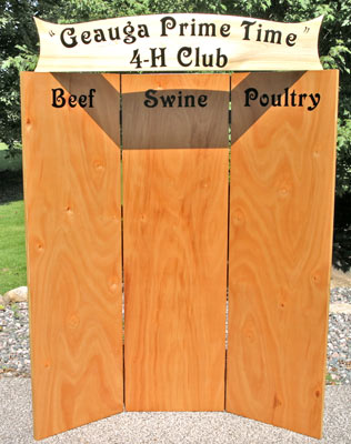 Vinyl lettering on a wooden sign Vinyl lettering on a wooden sign