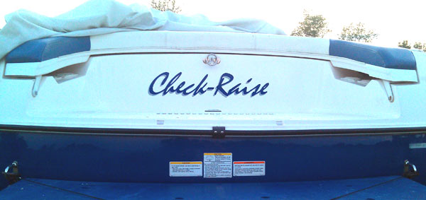 Custom vinyl lettering on a boat. Custom vinyl lettering on a boat.