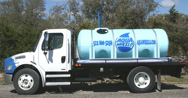 Custom lettering on a water truck Custom lettering on a water truck
