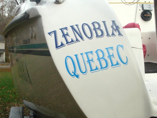Custom vinyl lettering on a boat Custom vinyl lettering on a boat